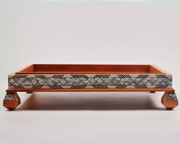 Large handcrafted wooden tray, carefully crafted and decorated with intricate mother-of-pearl inlays for an open buffet.