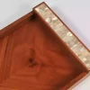 A set of handmade rectangular wooden trays inlaid with pearl pieces in a wonderful geometric shape