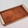 A set of handmade rectangular wooden trays inlaid with pearl pieces in a wonderful geometric shape