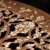 Round table carved and inlaid with mother-of-pearl