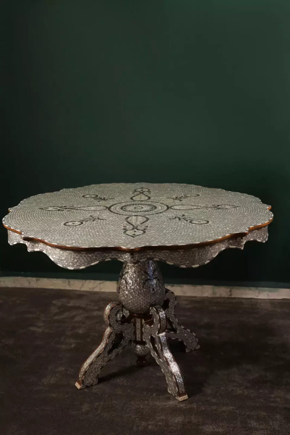 Round table completely inlaid with mother-of-pearl