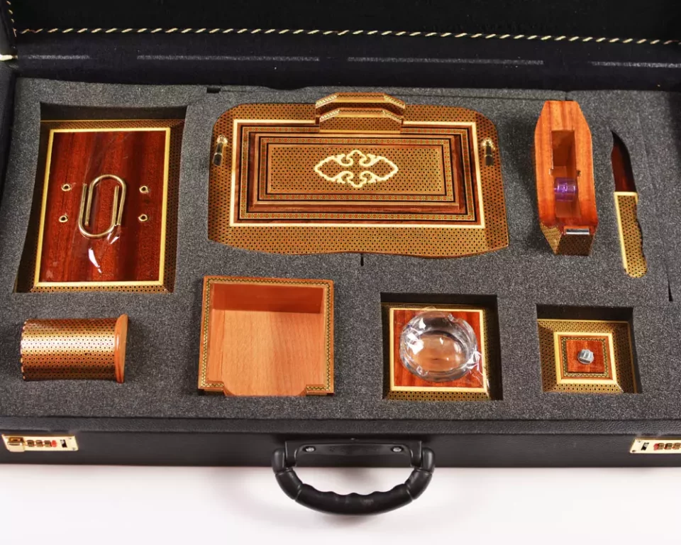 A distinctive and luxurious desk set, handcrafted from lemon wood and inlaid with copper