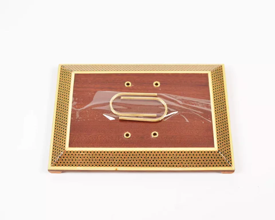 A distinctive and luxurious desk set, handcrafted from lemon wood and inlaid with copper