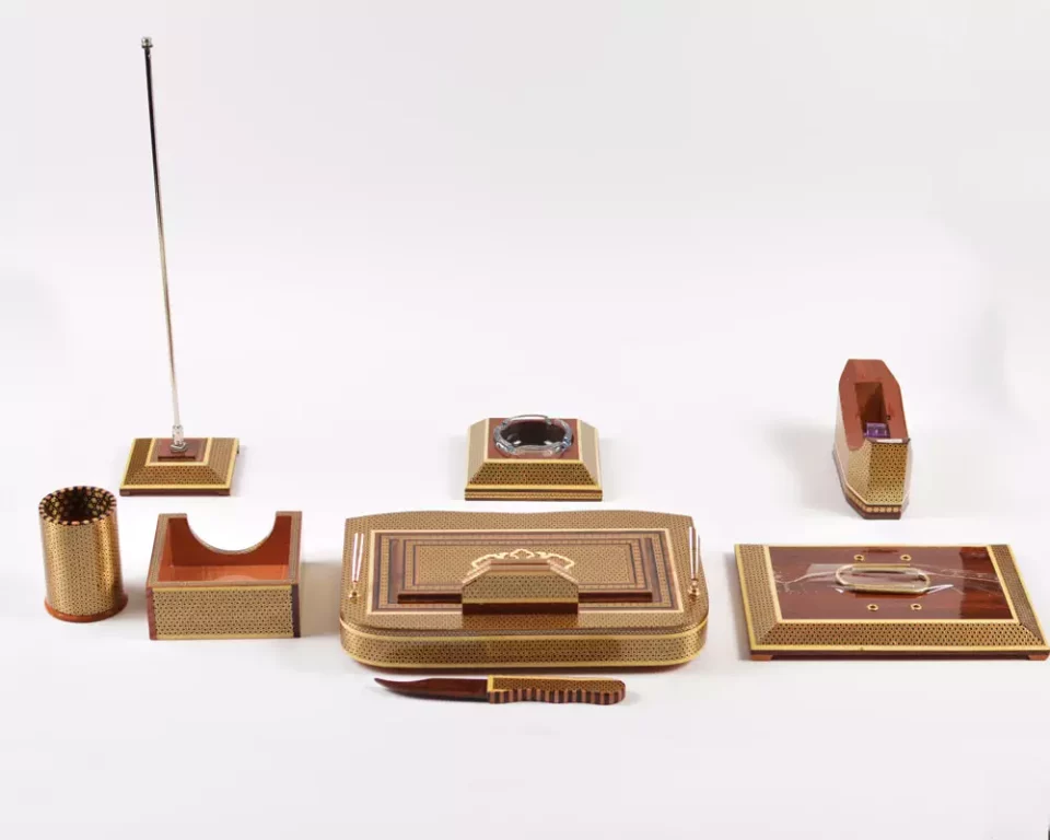 A distinctive and luxurious desk set, handcrafted from lemon wood and inlaid with copper