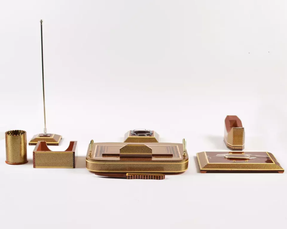 A distinctive and luxurious desk set, handcrafted from lemon wood and inlaid with copper