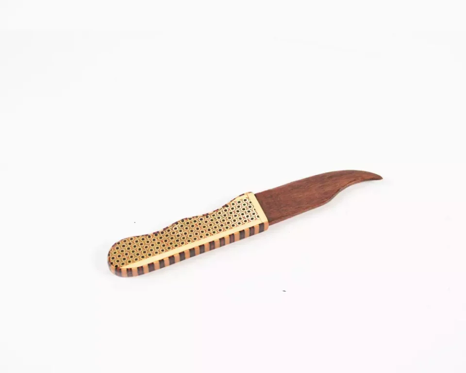 A distinctive and luxurious desk set, handcrafted from lemon wood and inlaid with copper