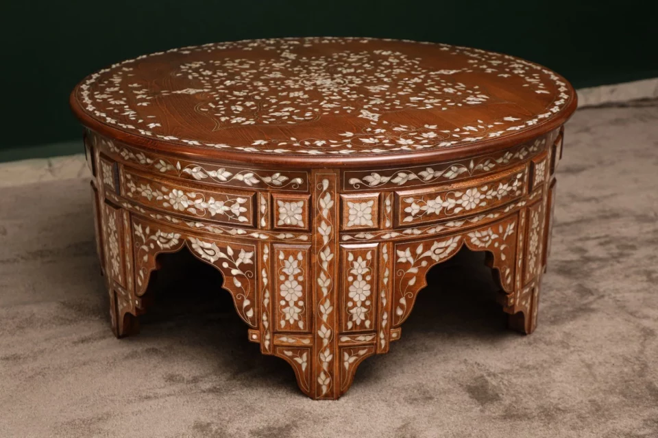 Handmade round wooden table inlaid with natural mother-of-pearl