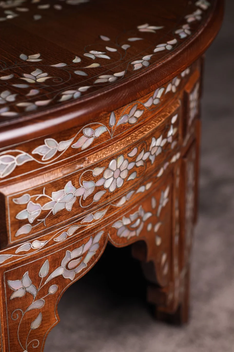 Handmade round wooden table inlaid with natural mother-of-pearl