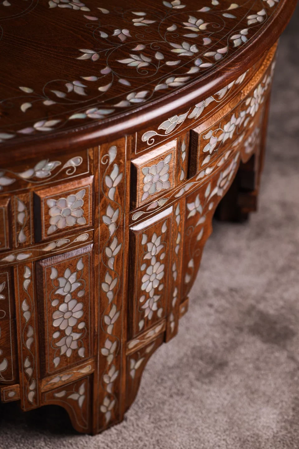 Handmade round wooden table inlaid with natural mother-of-pearl
